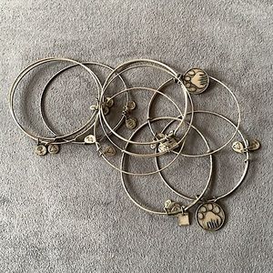 Two sets of Alex + Ani Silver Paw charity bangles